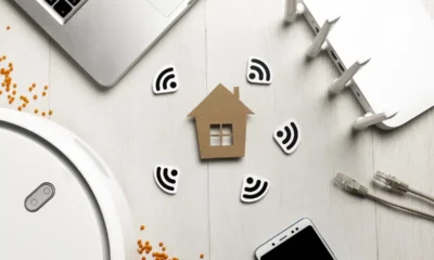 top view wi fi router with house figurine wireless controlled devices.jpg