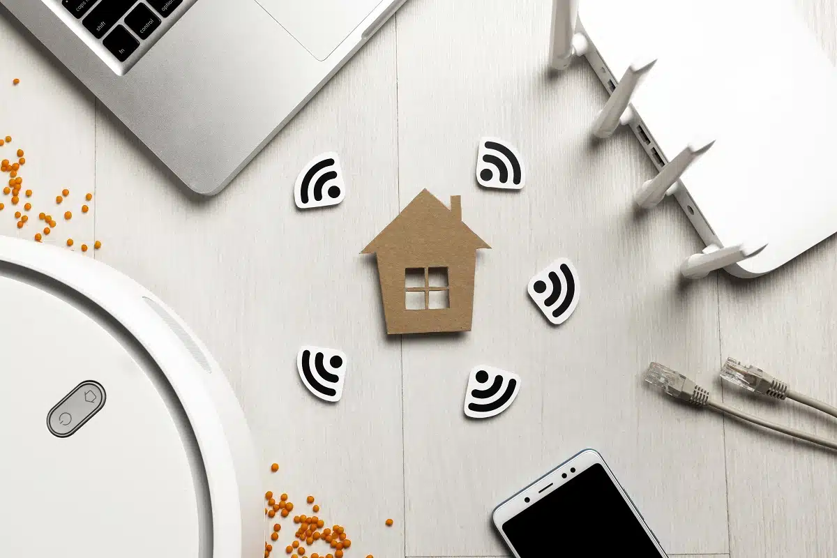 top view wi fi router with house figurine wireless controlled devices.jpg